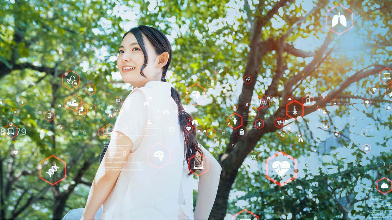 A smiling young woman in white glances over her shoulder amid a lush green tree canopy, with digital health and wellness icons overlaid across the image.